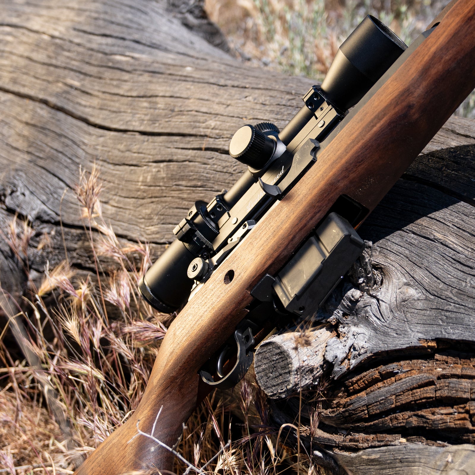 A springfield M1a rifle with M1000 scope on top