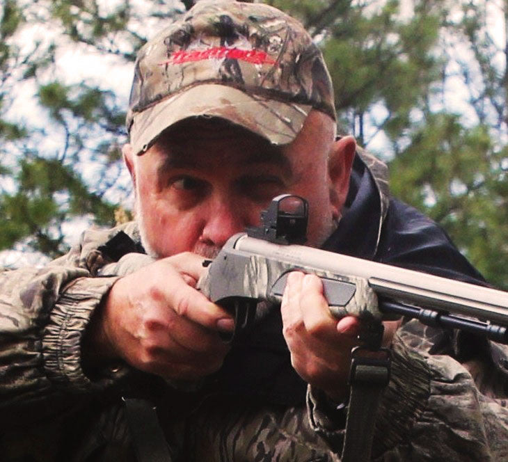 toby bridges with a red dot sight on his shotgun