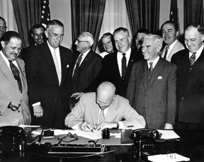 President Ike signing the Documents