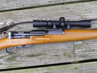 the scout scope mounted on a k31 rifle