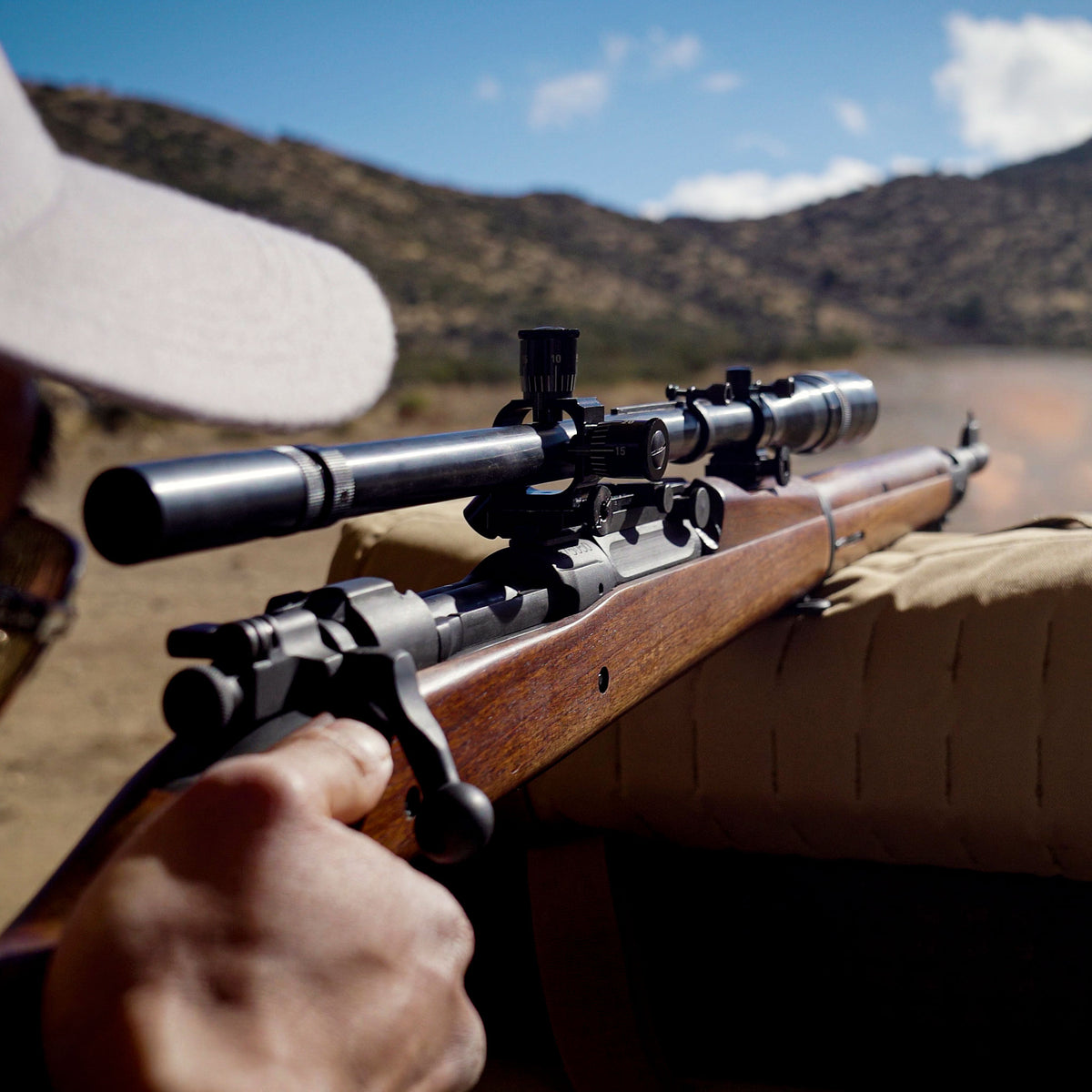 Rear view of the 8X Gen ii scope atop a 1903 being fired on the bench