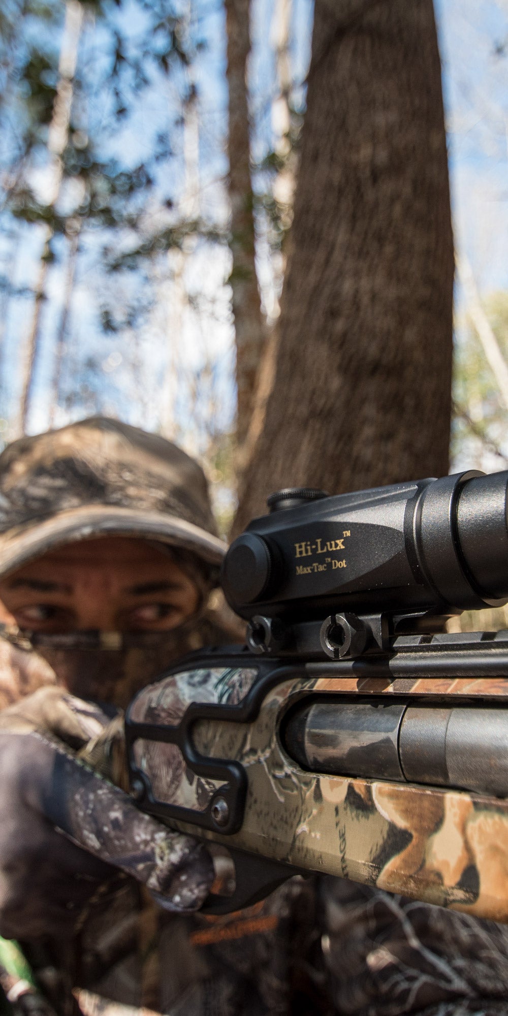 MTD Red dot atop a shotgun, out hunting in the woods