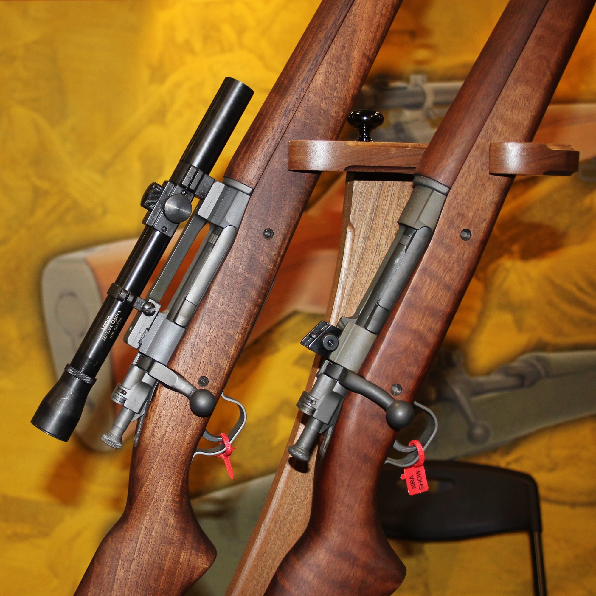 Two 1903 Springfield rifles, one with the M82G2 scope mounted atop