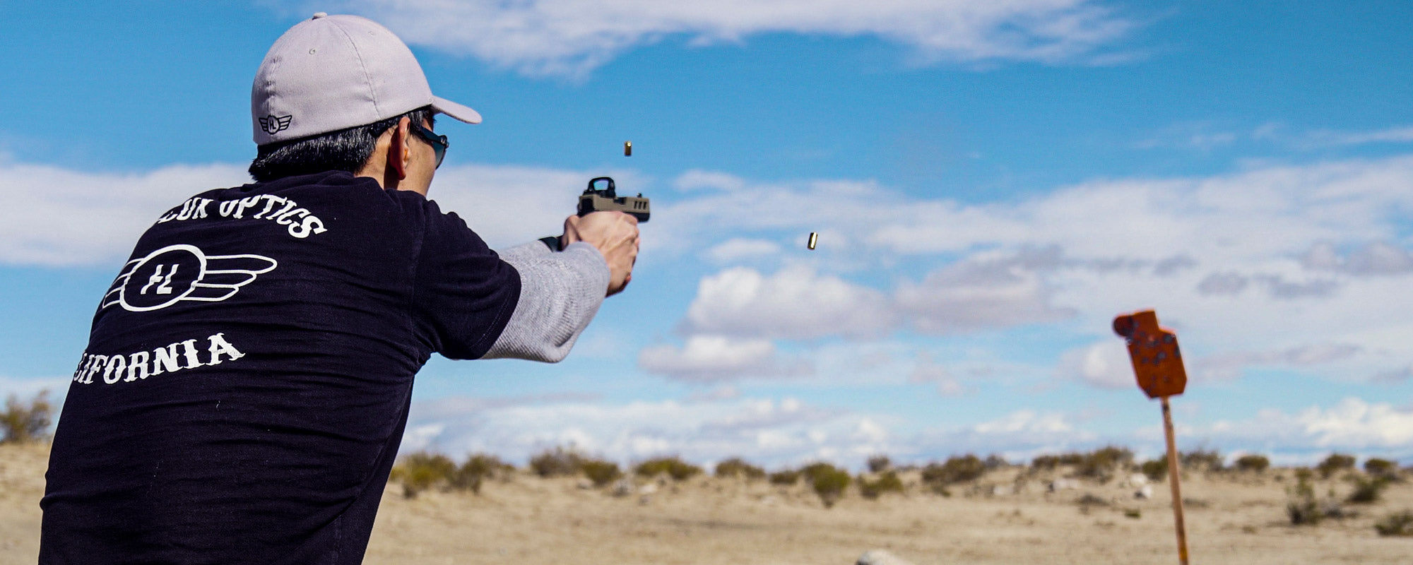 TD3 red dot atop a Glock, shooting steel in the desert